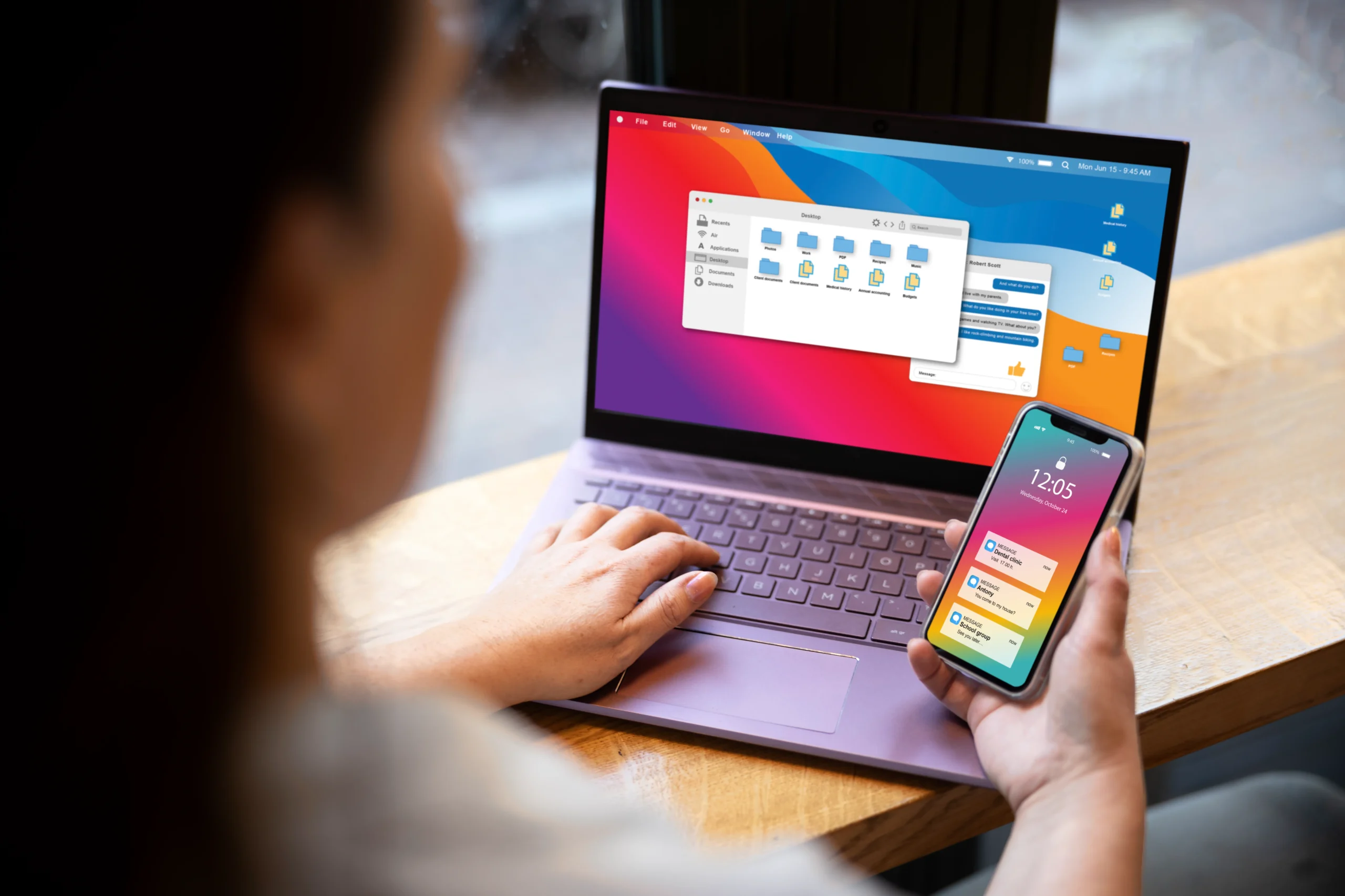 Mobile responsive design on a phone near a laptop